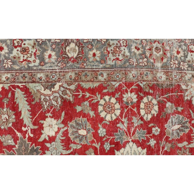 Antique Persian Fine Weave Tabriz in Red Background With Earth Tones For Sale - Image 9 of 12