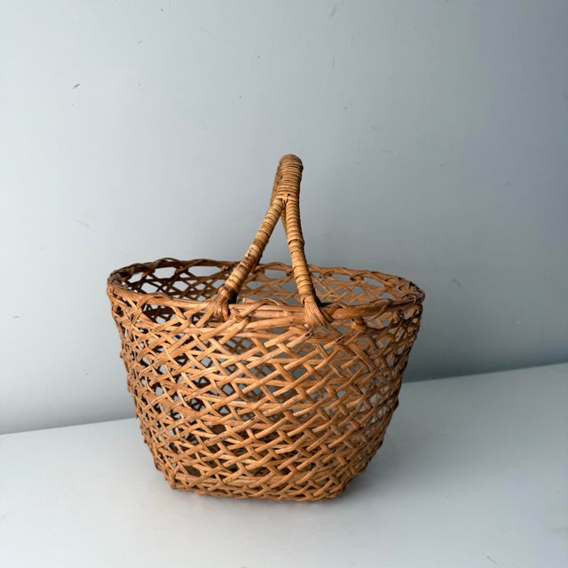 Vintage Japanese bamboo woven Ikebana (hanakago) flower basket with a lovely lighter color and patina.