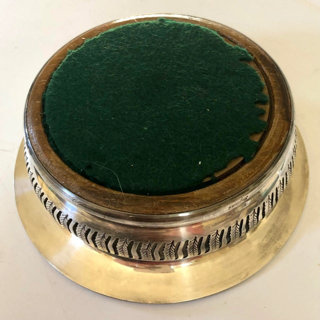 This beautiful mid century wine coaster was produced by one of England's famous silversmiths, Barker Brothers in...