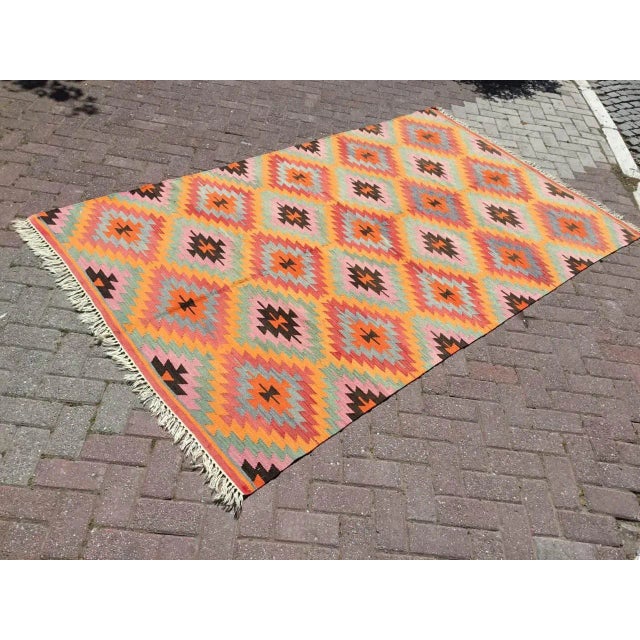 Beautiful, vintage, handwoven Kilim is approximately 60 years old. It is handmade of very fine quality, hand-spun wool in...