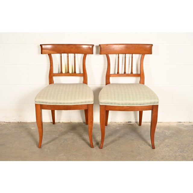 An outstanding pair of Regency or Neoclassical style Klismos side chairs or dining chairs By Kindel Furniture USA, Circa...