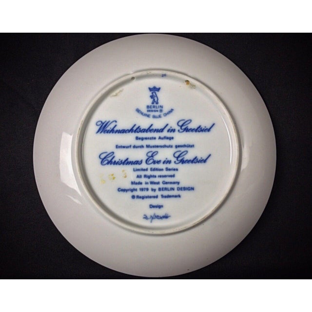 This charming vintage wall-mounted decorative plate captures the warmth and tradition of Christmas Eve in the picturesque...