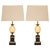 This elegant pair of table lamps is attributed to Maison Charles, Paris, and dates to the mid-20th century, reflecting the...