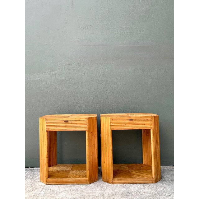 This sophisticated pair of vintage hexagonal nightstands is a stunning example of artisanal rattan craftsmanship,...
