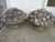 Monumental pair of Vintage stone fruit and flower baskets. Lovely aged patina to these beautiful detailed bouquets. These...