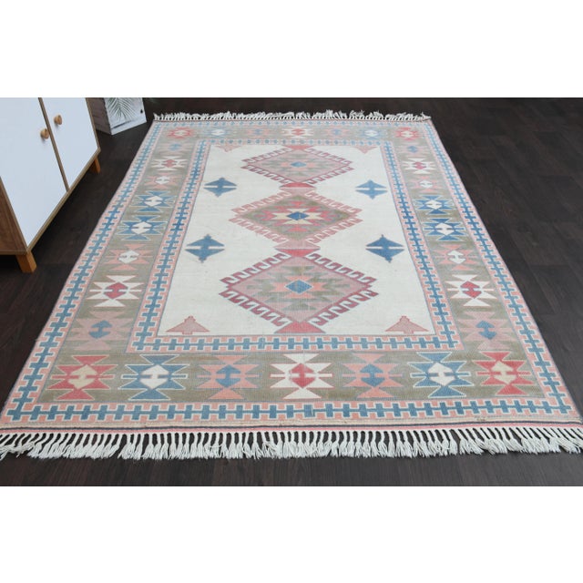 Vintage Turkish Hand-Knotted vintage rug is a semi-antique vintage Area rug.'70s Eastern region of Turkey's unique rug is...