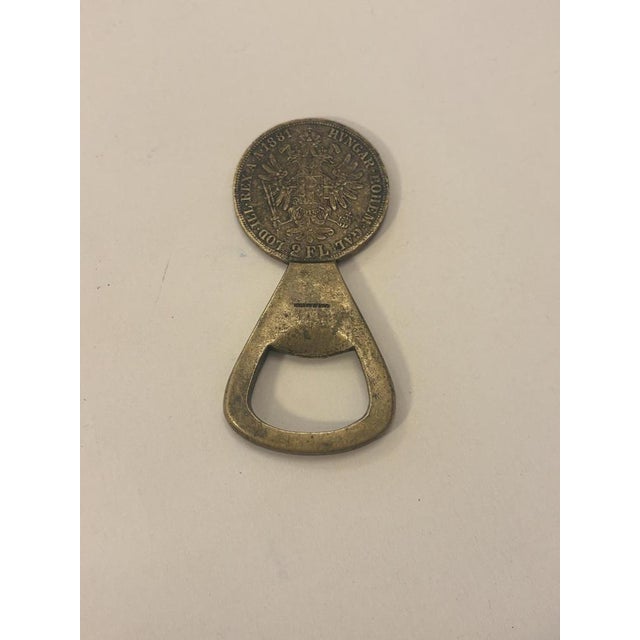 Brass coin-operated bottle opener by Carl Auböck for the Carl Auböck workshop, Austria, 1950s Length: 7.5 cm The coin...