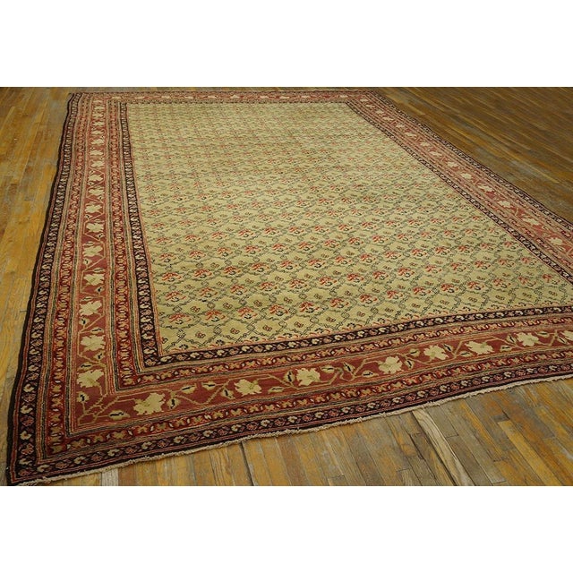 The cream field displays a small, interlocking curvy lattice in a vaguely Caucasian style, all enclosed in a five stripe...