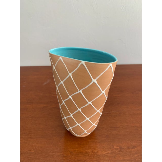 Lovely Italian Mid Century Modern vase by Alvino Bagni. A tan exterior with a crisp white cross pattern hiding a beautiful...