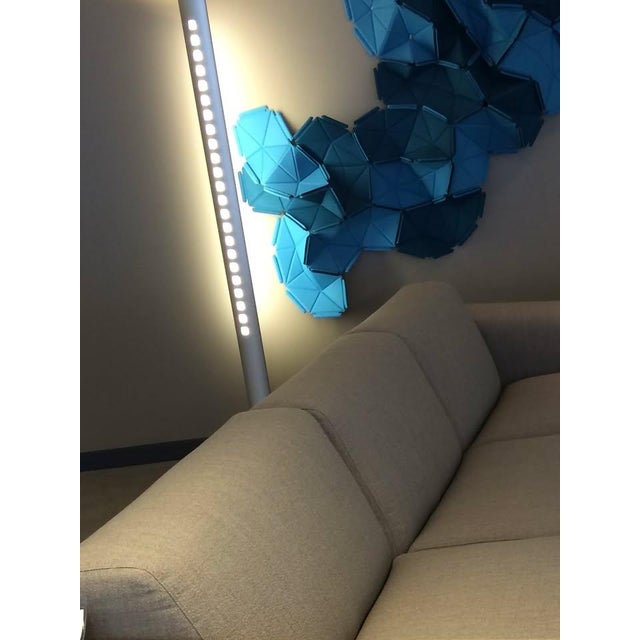 This is a vintage Ligne Roset Extensia floor lamp. This lamp is a postmodern design, featuring a brushed aluminum finish,...