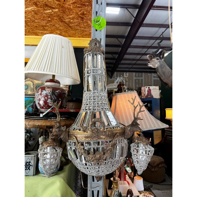 Up for consideration is a beautiful vintage pair of gold deer head stag crystal sconces. These would look lovely in your...
