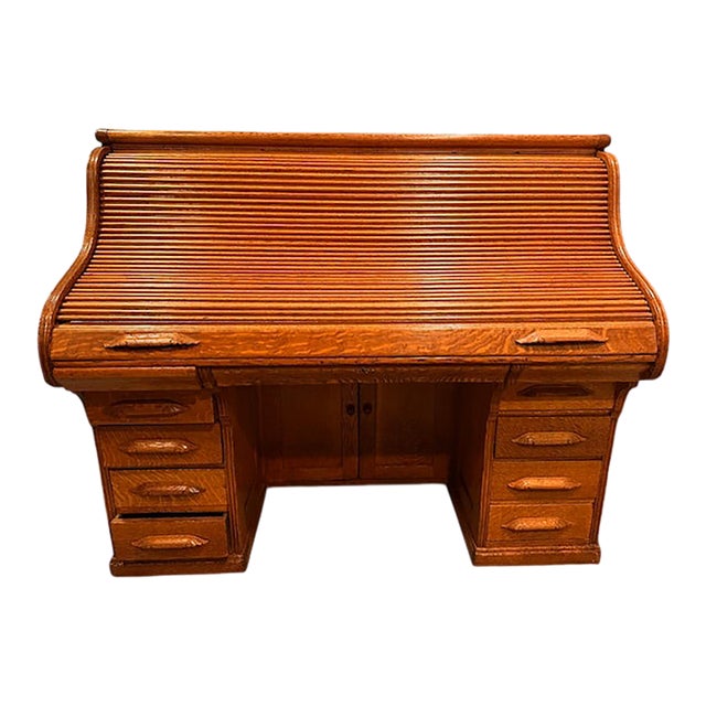 Beautiful old Rolltop desk. Original finish and patina. Unusual. Complete. In good condition as would be expected with...