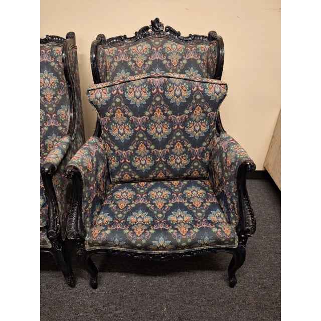 Antique pair of rococo style hand painted and custom upholstered floral design wingback chairs. They are 8n original...