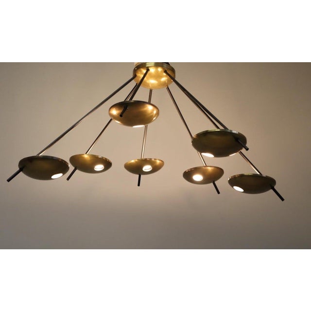 Original Stilnovo chandelier or wall light, model 1036, created in Italy around the 1950s. The central fixture supports...