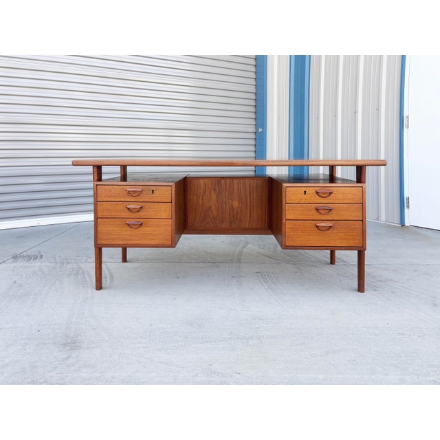 ✨ Mid-Century Danish Modern Teak Executive Desk by Kai Kristiansen ✨ This outstanding mid-century executive desk, designed...