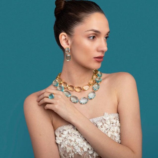 The Renata Earrings embody understated sophistication, skillfully combining green and blue quartz for simple elegance. The...