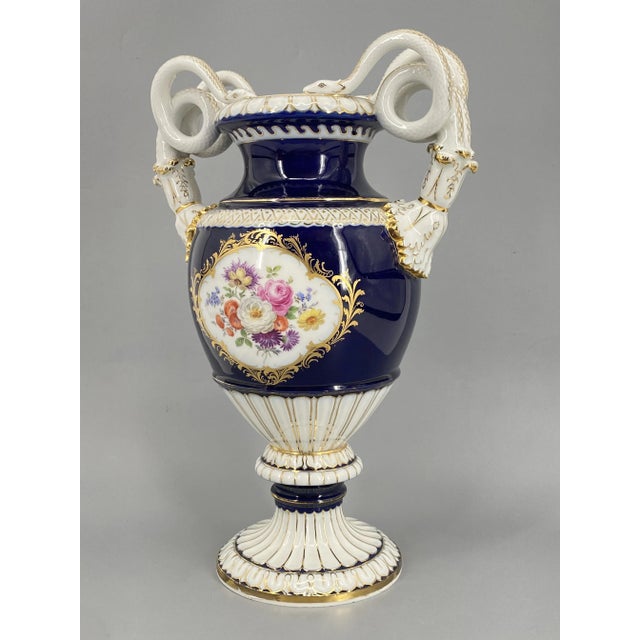 A flower vase *Designed by Ernst August Leuteritz in 1860 *Vase with mounted base *Made of Meissen porcelain *Hand-painted...