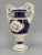 A flower vase *Designed by Ernst August Leuteritz in 1860 *Vase with mounted base *Made of Meissen porcelain *Hand-painted...