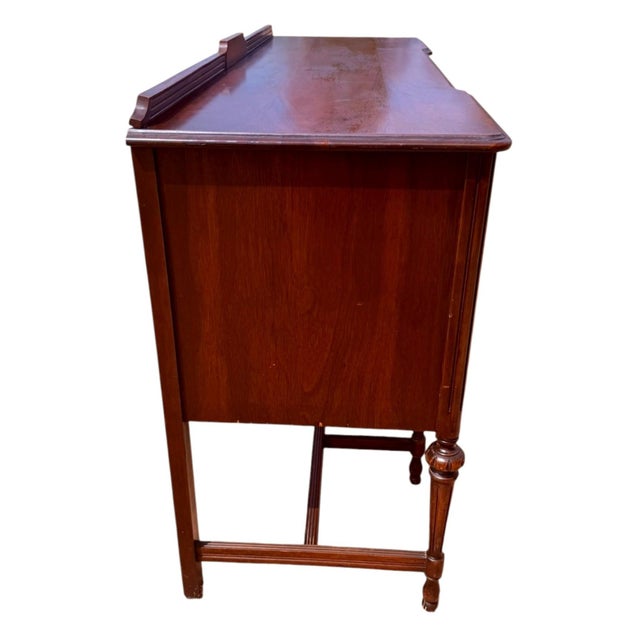 Beautiful circa 1920s American Federal / Hepplewhite Revival buffet or sideboard featuring a warm walnut-toned finish,...