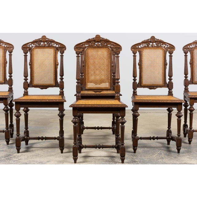 A charming set of six late 19th century French dining chairs executed in the Renaissance Revival, Henri II style, sourced...