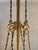 This is a large chandelier, measuring approximately 90 cm in height and 60 cm in diameter. The frame is crafted from gilt...