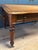 Beautiful antique mahogany writing table with two drawers on each side, making it suitable for two people. Tan-colored,...