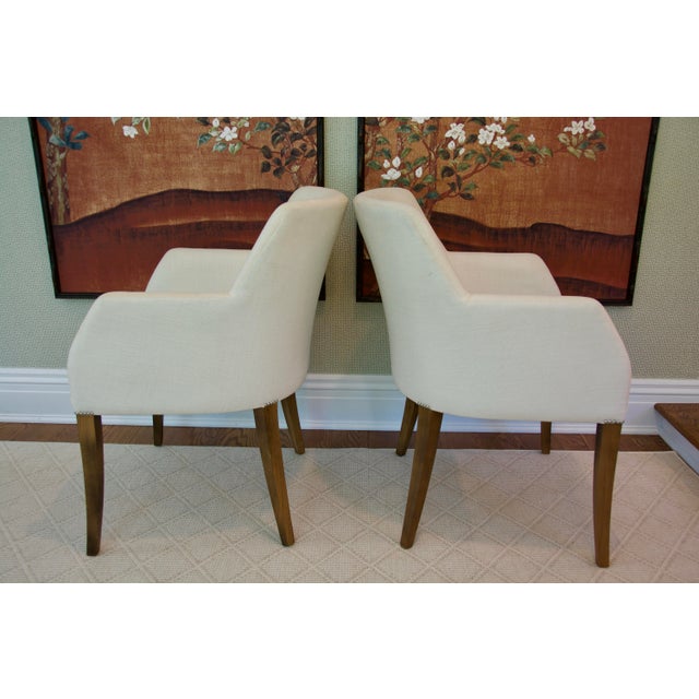 Elegant Pair of Bright Chair Maria Arm Chairs upholstered in Jane Churchill Darwin Cream with natural oiled walnut finish...