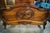 A romantic antique French bed dating to the late 19th or early 20th century. Crafted in warm walnut, the bed features a...