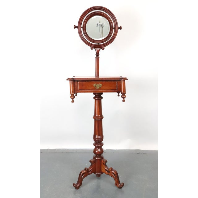 This Victorian style reproduction gentleman's shaving stand features a tabletop storage with compartments, polished brass...