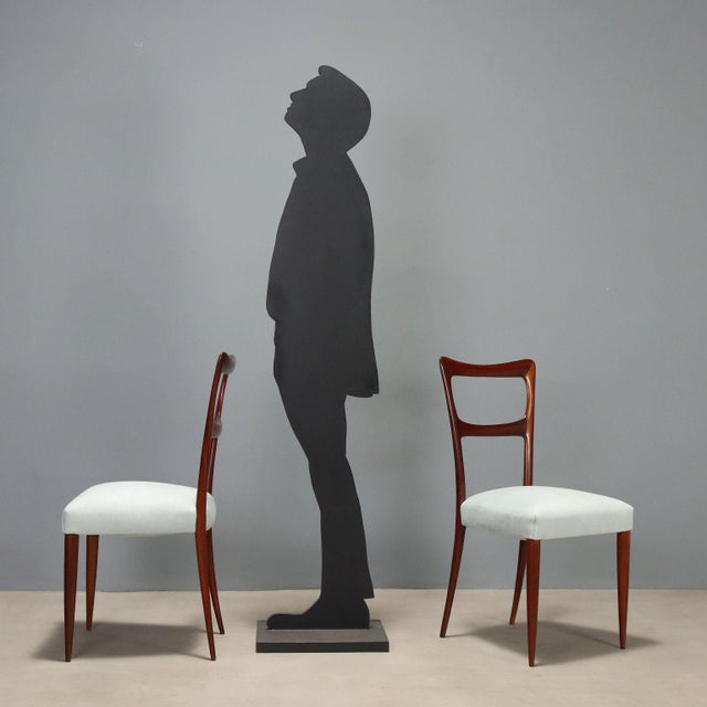 Elegant set of four chairs dating back to the 1950s, crafted from fine mahogany wood. The structure is distinguished by...
