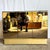 This glamorous postmodern credenza features sleek smoked-mirror doors framed in shimmering gold, creating a bold...