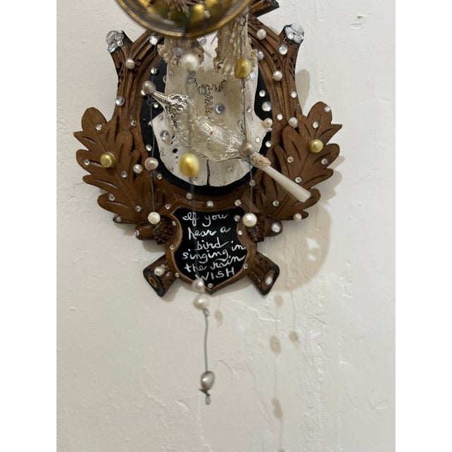 Wonderful found object wall sculpture that began as an antique Black Forest deer skull on plaque, transformed into a...