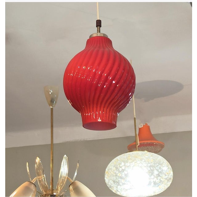 A ceiling lamp made of laminated glass, a beautiful example of the design of the 1960s. Lamp shade made of laminated...
