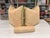 Two 21" square down filled pillows in peach and cream Fortuny-style fabric and one 14" X 4" down filled bolster in peach...