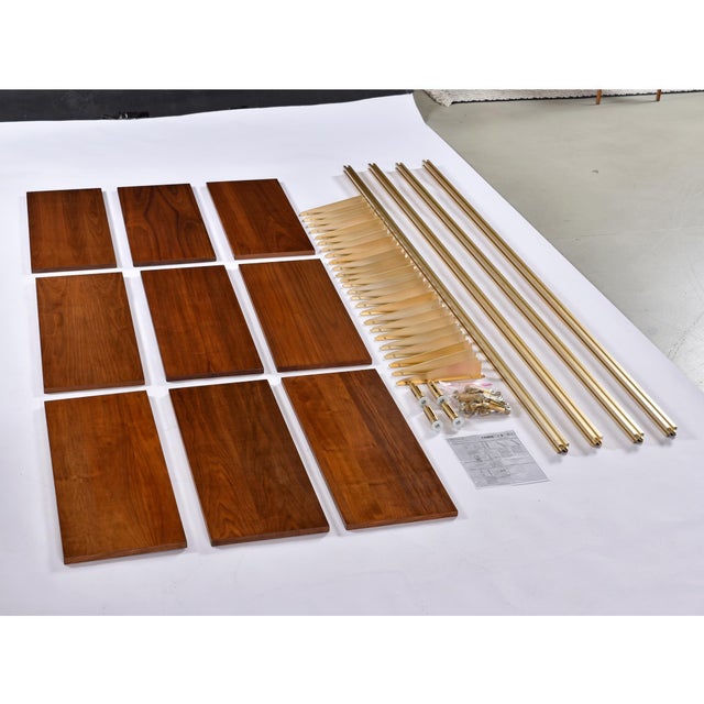 This George Nelson "Omni" Modular Wall Unit transforms the iconic shelving system into a statement of modern luxury. This...