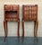 Pair of French walnut bedside tables adorned with fine Louis XV marquetry from the early 19th century. This pair of French...