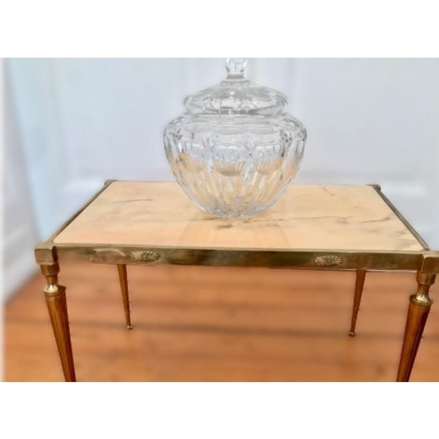 A very beautiful Italian ornate, rectangular brass table or side table with a very elegant marble top in Art Deco design.