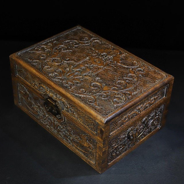 This is a finely carved vintage Chinese wooden treasure box, crafted from rosewood (Huali wood). The box features an...