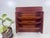 A warm, functional Mid-Century accent for the entryway. This Goodwood wall organizer is made of genuine teak and features...