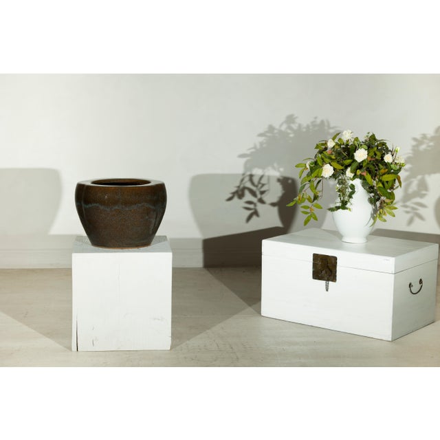 This vintage Chinese ceramic planter features a rounded, gently tapered form with a broad open mouth and softly scalloped...