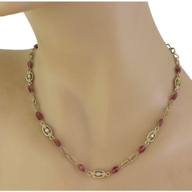 This lovely necklace is crafted from 18k yellow gold featuring leaf style oval link with bezel set natural diamond and...