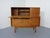 Meredew Teak Secretary from the 1060s. Equipped with 2 sliding doors. Behind it a continuous shelf. On the top with...