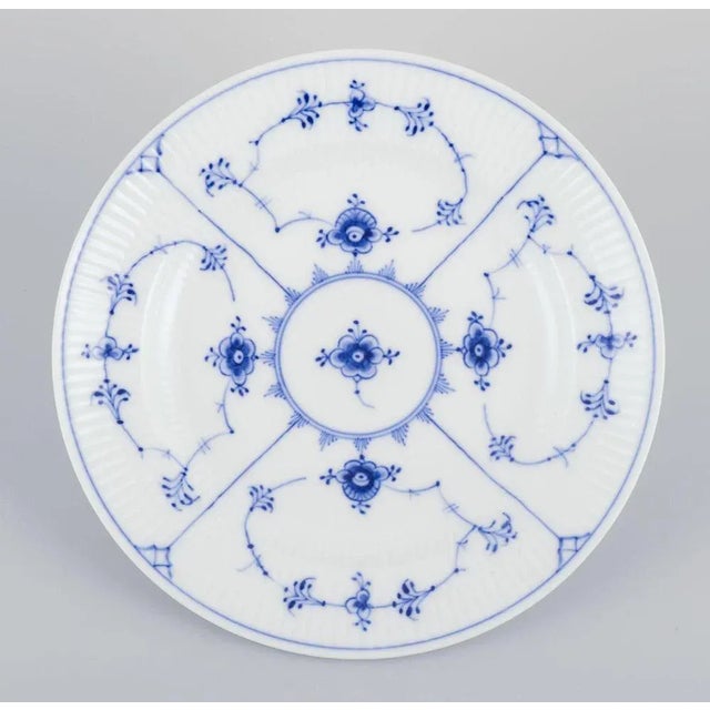 Royal Copenhagen Blue Fluted Plain. A set of six porcelain luncheon plates. Model 1/176 Date: 1938 Marked. Perfect...