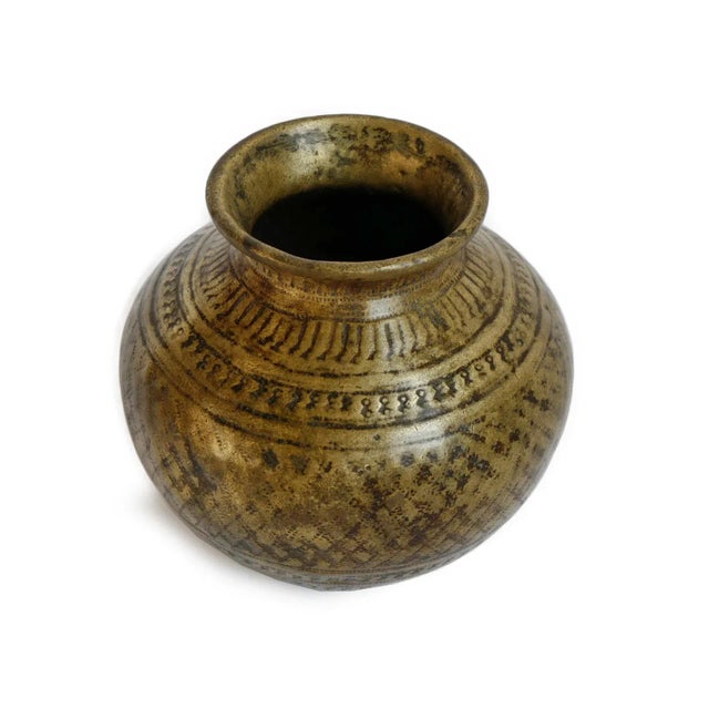 A beautifully aged small Nepali bronze vessel inspired by the traditional kalasha form, historically associated with...