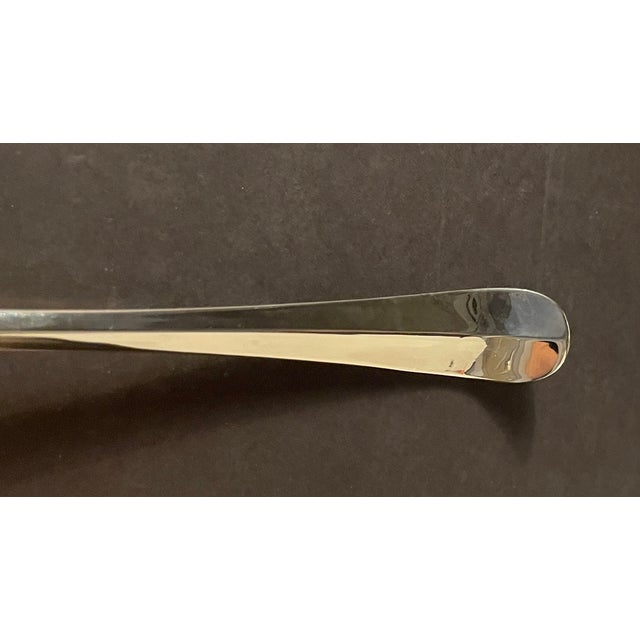 A set of six 13 inch silverplated serving spoons, sometimes referred to as rice spoons in the South. Circa 1960s, in the...
