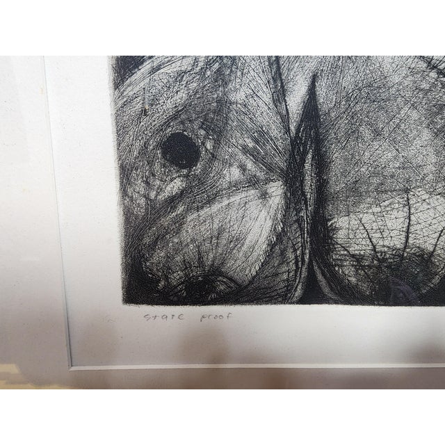 I find this drawing to be creepy and disturbing. The more you study it the more powerful it is. It is framed in a wooden...