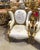 In love with the design. Beautiful white chair with gold frame. It has a unique and gorgeous antique white damask fabric....
