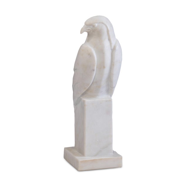 Carved from luminous white marble, this stylized falcon stands as an emblem of vision and mastery. With its sweeping...