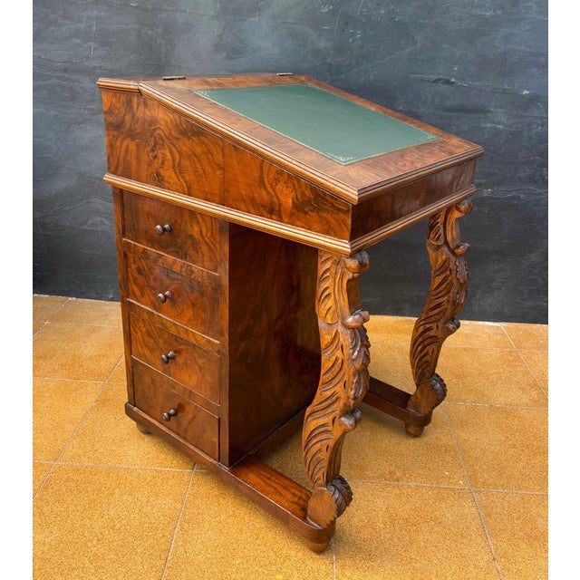 Regency style burr walnut Davenport desk, 20th century. This compact writing desk features a slanted leather inset writing...