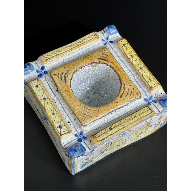 This charming and highly decorative antique Spanish inkwell is crafted in the traditional Talavera de la Reina style,...